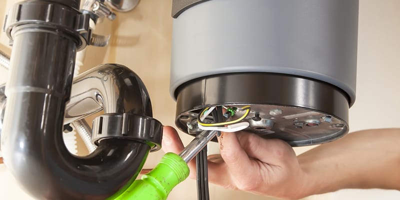 Technician repairing the heating element of a water heater in Clearwater